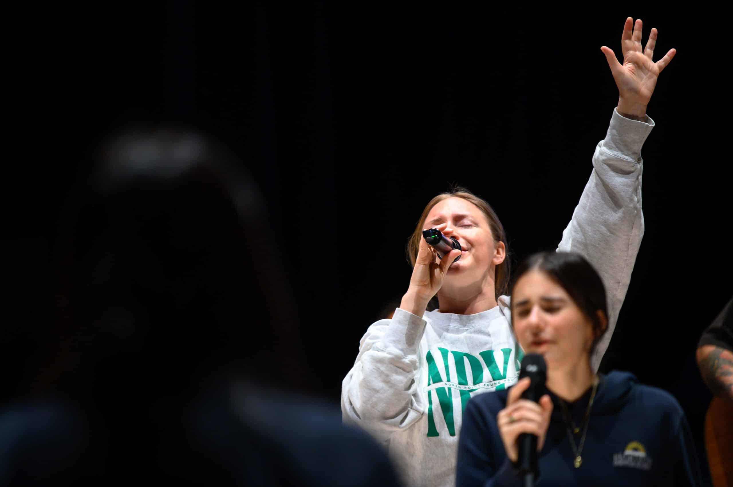 young girl praising and worshiping