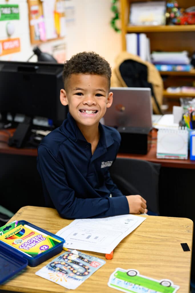 young male student smiling at camera