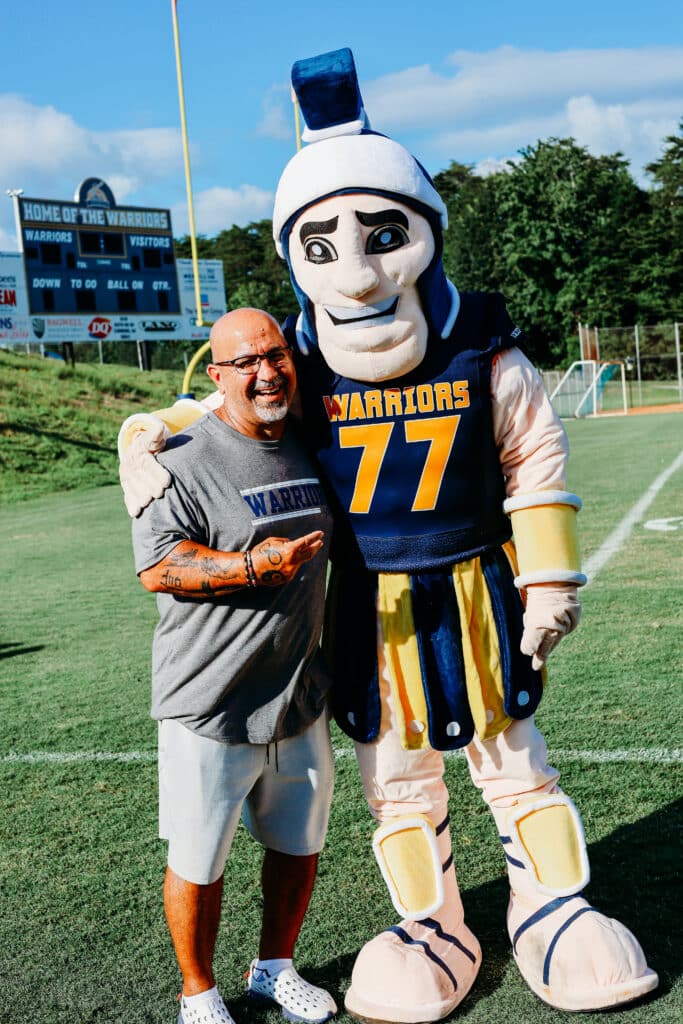 HCA staff member with HCA mascot
