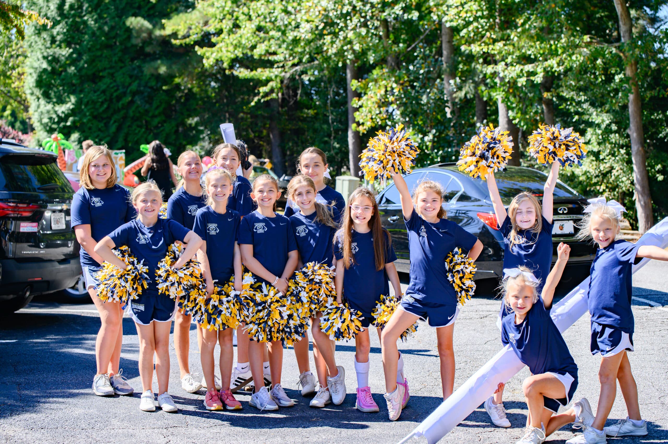 HCA cheer squad group photo with pom poms